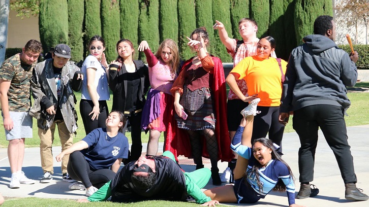 The Dance Club poses for a group photo after an outdoor performance.